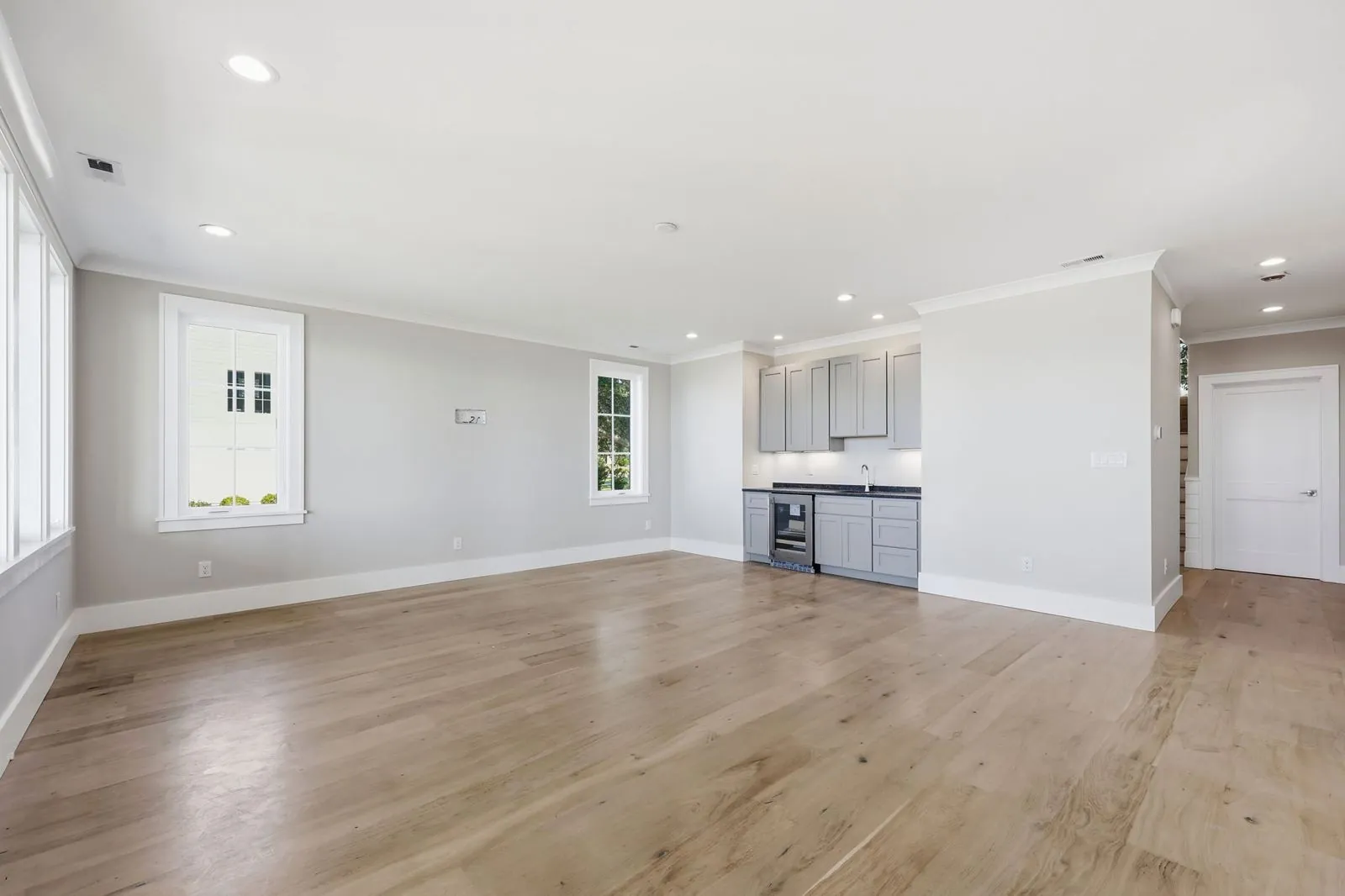 Ground-floor rec room with wet bar and beverage refrigerator